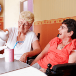 carer pouring a cup of