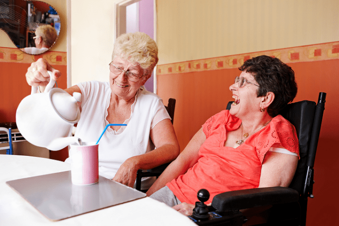 carer pouring a cup of 