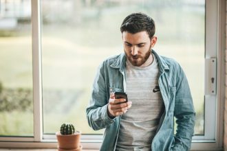 Man looking at message on phone