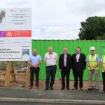 image of 3 housing officers, two construction works and Councillor David Bithell in front of the site