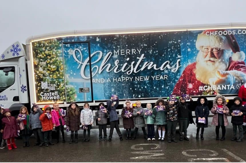 Pupils with Santa and the Castell Howell Foods Christmas truck