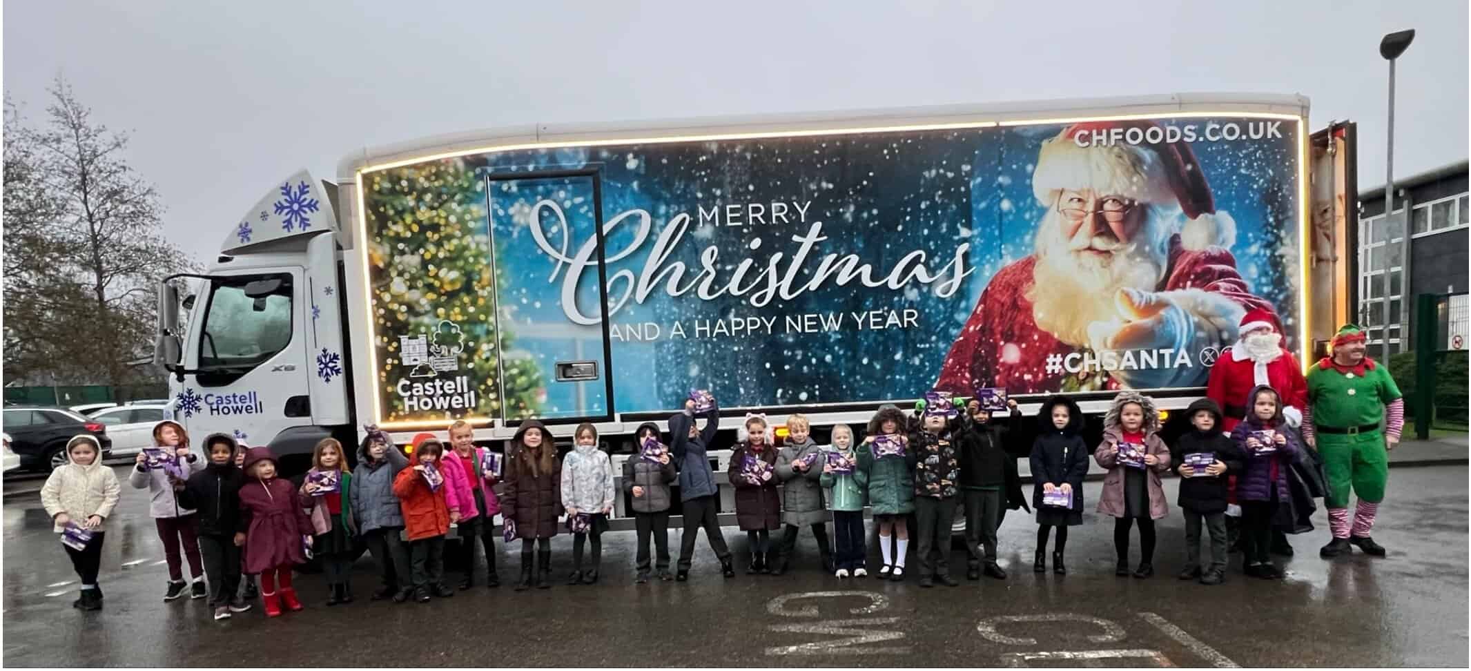 Pupils with Santa and the Castell Howell Foods Christmas truck