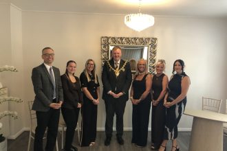 Mayor with the Registrar team